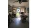 Bright sunroom featuring large windows, tile flooring, and ample seating at 509 Del Mar Dr, Lady Lake, FL 32159