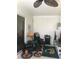 Relaxing sunroom with tile floors, fan, decorative plants and unique accent rug at 509 Del Mar Dr, Lady Lake, FL 32159