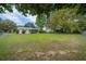 Wide shot of a large backyard, showcasing lawn space and partial home exterior at 6385 Sw 61St Ct, Ocala, FL 34474