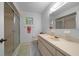 Bright bathroom featuring updated shower, light cabinets and coordinated accessories at 6385 Sw 61St Ct, Ocala, FL 34474