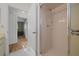 Bathroom with updated shower, neutral cabinets and modern fixtures at 6385 Sw 61St Ct, Ocala, FL 34474