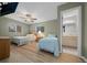 Bright bedroom with twin beds, ceiling fan and view of the bathroom at 6385 Sw 61St Ct, Ocala, FL 34474