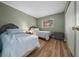 Bright bedroom with two twin beds, wood floors and view of window at 6385 Sw 61St Ct, Ocala, FL 34474