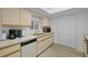 Bright kitchen featuring white cabinetry, appliances, and modern flooring at 6385 Sw 61St Ct, Ocala, FL 34474