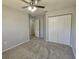 Bedroom with neutral walls, closet, carpeting, and ceiling fan at 6767 Sw 114Th Street Rd, Ocala, FL 34476