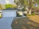 Charming single-story home with attached garage and a beautifully landscaped front yard at 6767 Sw 114Th Street Rd, Ocala, FL 34476
