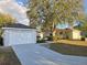 Single-story home boasts a well-manicured lawn, attached garage, and inviting curb appeal at 6767 Sw 114Th Street Rd, Ocala, FL 34476