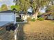Well-maintained home featuring lush landscaping, attached garage, and clearly visible street numbers at 6767 Sw 114Th Street Rd, Ocala, FL 34476