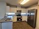 Well-equipped kitchen boasts stainless steel appliances and ample counter space for cooking convenience at 6767 Sw 114Th Street Rd, Ocala, FL 34476
