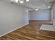 Spacious living room features modern flooring and stylish chandelier for a bright and airy feel at 6767 Sw 114Th Street Rd, Ocala, FL 34476