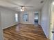 Bright living room with hardwood floors, ceiling fan, and natural light at 6767 Sw 114Th Street Rd, Ocala, FL 34476