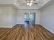 Spacious living room features modern flooring and sliding glass doors to the patio at 6767 Sw 114Th Street Rd, Ocala, FL 34476