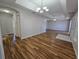Spacious living room features modern flooring and stylish chandelier for a bright and airy feel at 6767 Sw 114Th Street Rd, Ocala, FL 34476