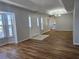 Bright living room boasts wood flooring, a tray ceiling, and lots of natural light at 6767 Sw 114Th Street Rd, Ocala, FL 34476