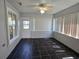 Enclosed patio with tiled floors and windows for year-round enjoyment of the outdoors at 6767 Sw 114Th Street Rd, Ocala, FL 34476