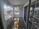 Covered porch with sliding glass doors and peaceful neighborhood views at 6767 Sw 114Th Street Rd, Ocala, FL 34476