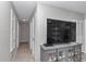 Hallway with gray walls, stylish light fixture and white doors at 736 Ne 26 Ter, Ocala, FL 34470