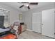Well-lit home office space featuring a ceiling fan, closet, and modern desk setup at 736 Ne 26 Ter, Ocala, FL 34470