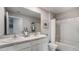 Well-lit bathroom featuring double sinks, neutral walls, and shower-tub combination at 8652 Sw 44Th Ter, Ocala, FL 34476