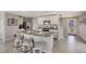 Modern kitchen featuring a center island with chairs, stainless steel appliances, and ample cabinet space at 8652 Sw 44Th Ter, Ocala, FL 34476