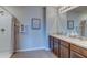Bright bathroom featuring a double vanity with stylish countertops and a walk-in shower with neutral decor at 8658 Sw 44Th Ter, Ocala, FL 34476
