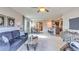 Open concept living area featuring modern furniture and decor leading to the kitchen at 8658 Sw 44Th Ter, Ocala, FL 34476