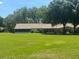 Spacious green backyard with mature landscaping and sunny skies at 9380 Sw 84Th Ter # E, Ocala, FL 34481
