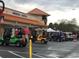 Festive golf carts parked in front of medical/dental offices, adorned with holiday decorations and lights at 9380 Sw 84Th Ter # E, Ocala, FL 34481