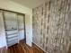 Bedroom closet with shelving and laminate wood flooring at 9380 Sw 84Th Ter # E, Ocala, FL 34481