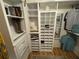 Spacious closet features custom shelving, drawers and a shoe rack for ample storage at 9380 Sw 84Th Ter # E, Ocala, FL 34481