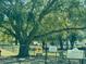 Community dog park with fenced area, seating, and information signs about park rules and WiFi access at 9380 Sw 84Th Ter # E, Ocala, FL 34481