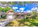 Charming single-story home with a well-manicured front yard and attached one car garage at 9380 Sw 84Th Ter # E, Ocala, FL 34481