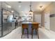 Well-appointed kitchen featuring a large island with seating, stainless steel appliances, and ample counter space at 9380 Sw 84Th Ter # E, Ocala, FL 34481