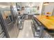 Beautifully designed kitchen showcasing stainless steel appliances, stylish cabinets, and efficient storage solutions at 9380 Sw 84Th Ter # E, Ocala, FL 34481