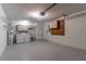 Spacious laundry room with washer, dryer, utility sink, storage cabinets, and a door leading to outside at 9380 Sw 84Th Ter # E, Ocala, FL 34481