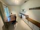Spacious office featuring built-in cabinets, a desk, and ample natural light at 9380 Sw 84Th Ter # E, Ocala, FL 34481