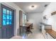 Bright office space with custom built-in cabinets and desk next to a beautiful blue door at 9380 Sw 84Th Ter # E, Ocala, FL 34481