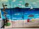 Beach themed mural on patio featuring coastal destinations at 9380 Sw 84Th Ter # E, Ocala, FL 34481