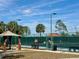 Tennis courts with a gazebo providing a comfortable seating area at 9380 Sw 84Th Ter # E, Ocala, FL 34481