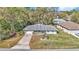 A lovely single-story home with mature trees and an extended driveway at 9844 Sw 198Th Cir, Dunnellon, FL 34432