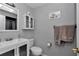 Bathroom with vanity, cabinet and gray walls at 9844 Sw 198Th Cir, Dunnellon, FL 34432