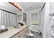 Bright bathroom with vanity, large mirror, and tile flooring at 9844 Sw 198Th Cir, Dunnellon, FL 34432