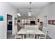 Bright open-concept dining area with skylights and seamless access to the living room at 9844 Sw 198Th Cir, Dunnellon, FL 34432