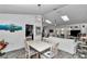 Dining area showcasing vaulted ceilings with skylights in an open floor plan at 9844 Sw 198Th Cir, Dunnellon, FL 34432