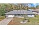 Charming single-story home featuring a well-maintained front yard and attached two-car garage at 9844 Sw 198Th Cir, Dunnellon, FL 34432