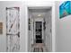 Hallway with decorative barn door accent, white trim and neutral paint at 9844 Sw 198Th Cir, Dunnellon, FL 34432