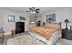 Bedroom featuring ceiling fan, closet and decorative accents at 9844 Sw 198Th Cir, Dunnellon, FL 34432