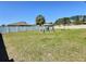 Spacious backyard with a white fence, providing privacy and space for outdoor activities at 1034 Se 65Th Cir, Ocala, FL 34472