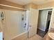 Bathroom featuring a shower-tub combo, modern fixtures, and a storage cabinet at 1034 Se 65Th Cir, Ocala, FL 34472