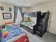 bedroom with playful decor, bunkbeds and carpeted floors at 1034 Se 65Th Cir, Ocala, FL 34472